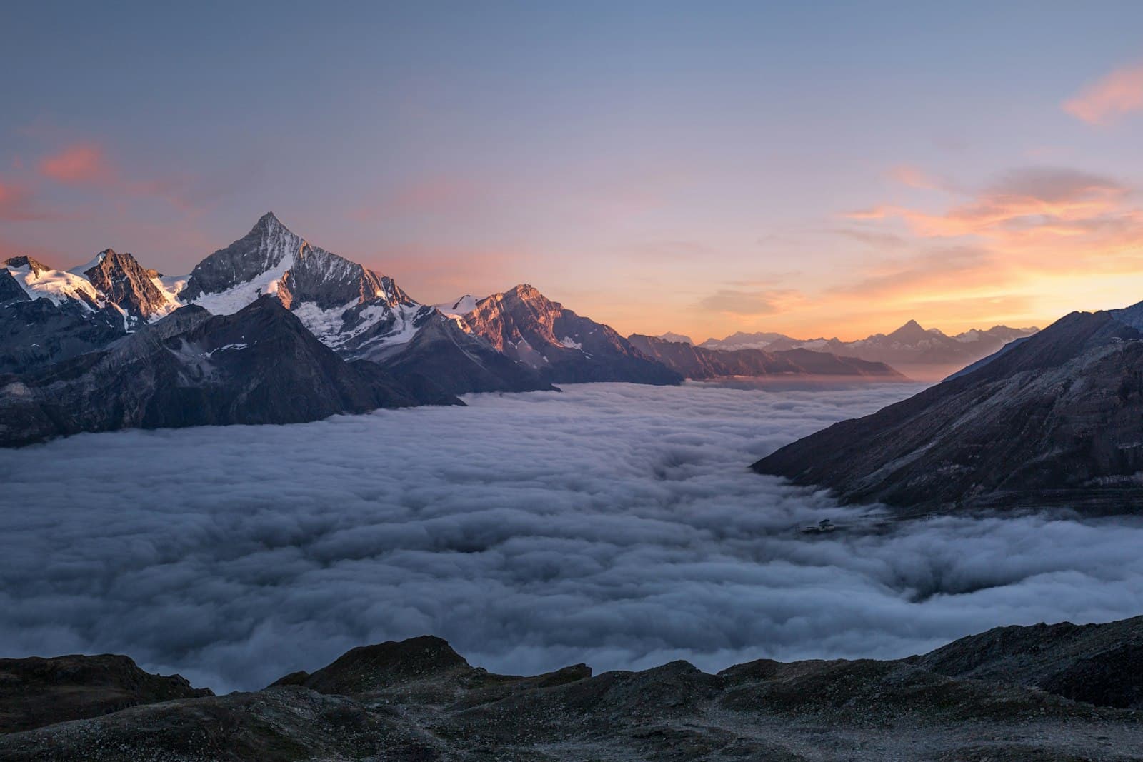 Snow-capped mountain peaks above a valley