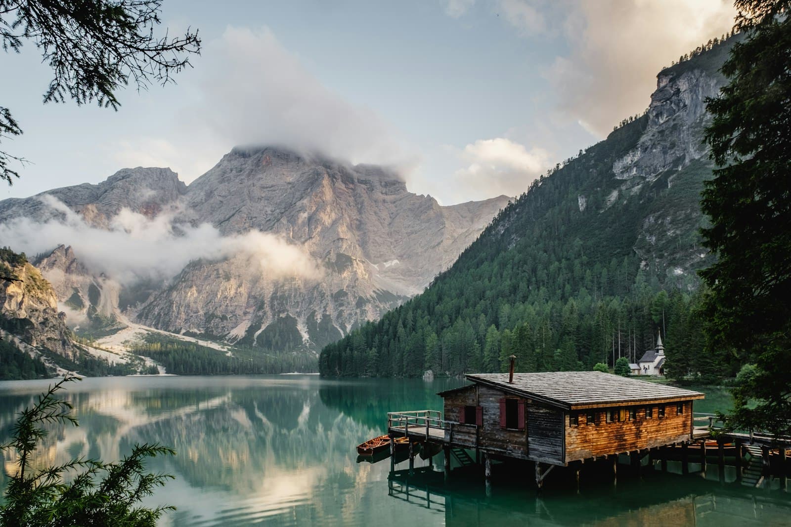Quiet alpine lake with mountain reflections